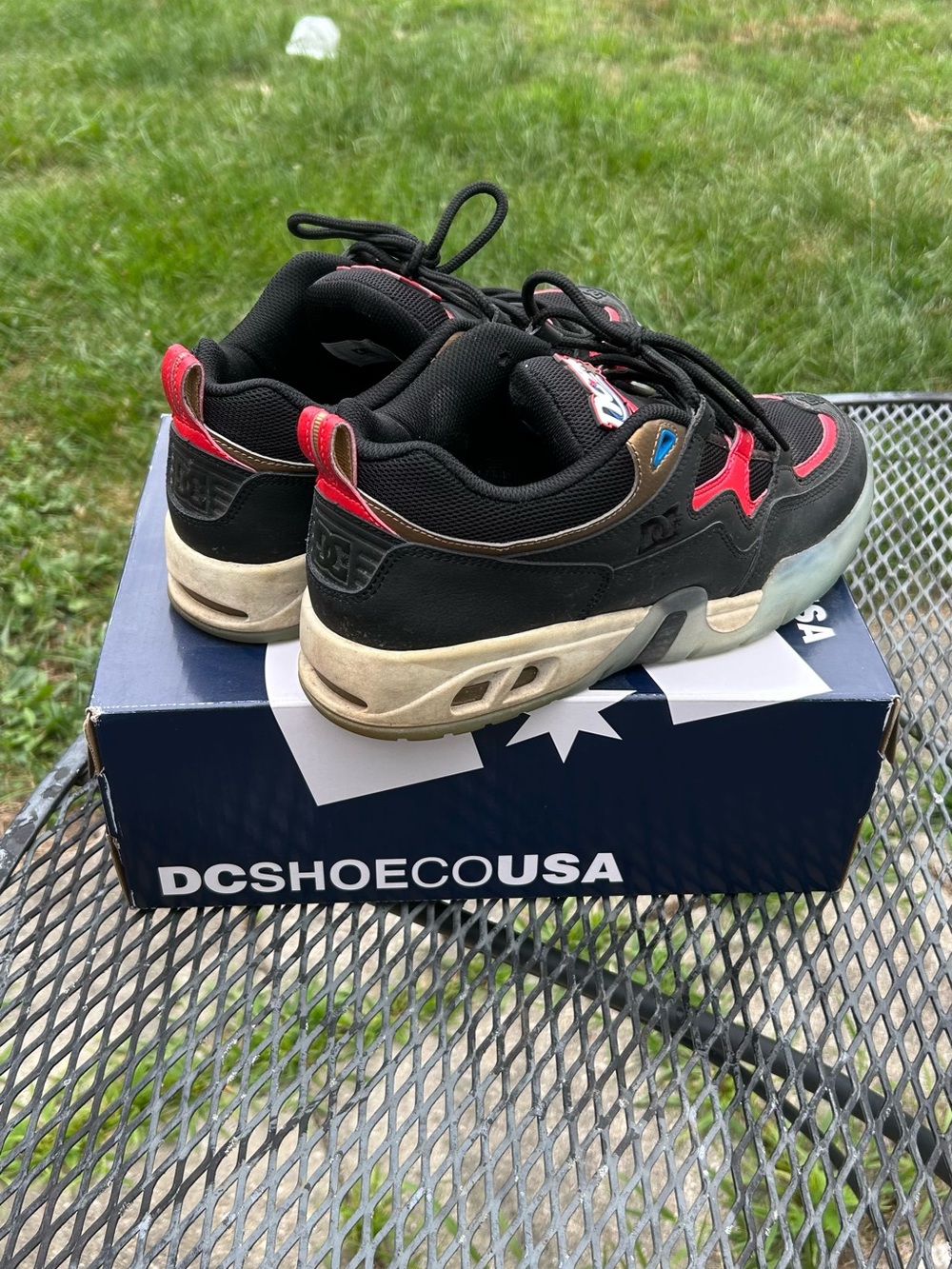 DC Men’s Black and Red Skate Shoes with Cream Sole